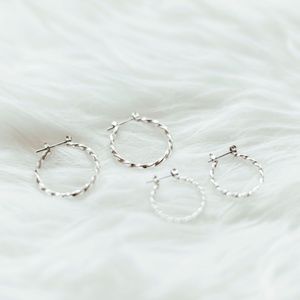 2 sets of twisted silver hoops